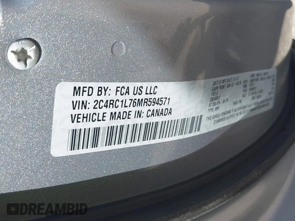 2021 Chrysler Pacifica Hybrid Touring L with VIN 2C4RC1L76MR594571, listed as a IAAI auction lot 40255745 with 58,163 mi miles and . Bid and sale history available at DreamBid. Image 9.