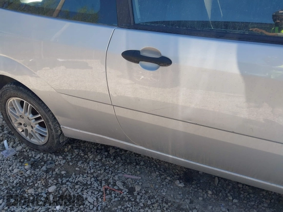 2005 Ford Focus S with VIN 3FAFP31N65R140634, listed as a IAAI auction lot 42126892 with 252,533 mi miles and . Bid and sale history available at carsss.com. Image 12.