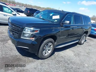 2015 Chevrolet Suburban LT z VIN 1GNSKJKC2FR162921, wystawiony jako IAAI lot #41961114 z przebiegiem 296 918 mil mil oraz . Historia ofert i sprzedaży dostępna na DreamBid. Obrazek 2.