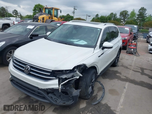 2023 Volkswagen Tiguan SE with VIN 3VVMB7AX0PM036876, listed as a IAAI auction lot 42023415 with 42,003 mi miles and . Bid and sale history available at DreamBid. Image 2.