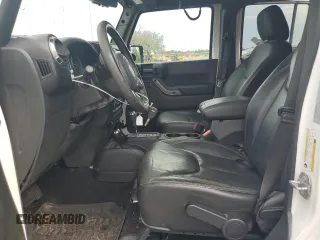 2018 Jeep Wrangler Unlimited Sahara with VIN 1C4BJWEG2JL851277, listed as a Copart auction lot 63631645 with 83,851 mi miles and Salvage title. Bid and sale history available at DreamBid. Image 7.