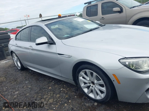 2014 BMW 6 Series 650i z VIN WBA6B2C58ED129639, wystawiony jako IAAI lot #42171786 z przebiegiem 108 677 mil mil oraz . Historia ofert i sprzedaży dostępna na DreamBid. Obrazek 13.