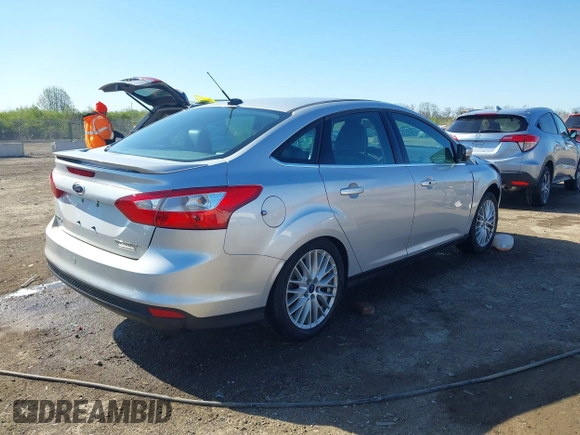 2014 Ford Focus Titanium with VIN 1FADP3J28EL354505, listed as a IAAI auction lot 42025966 with 104,868 mi miles. Bid and sale history available at carsss.com. Image 4.