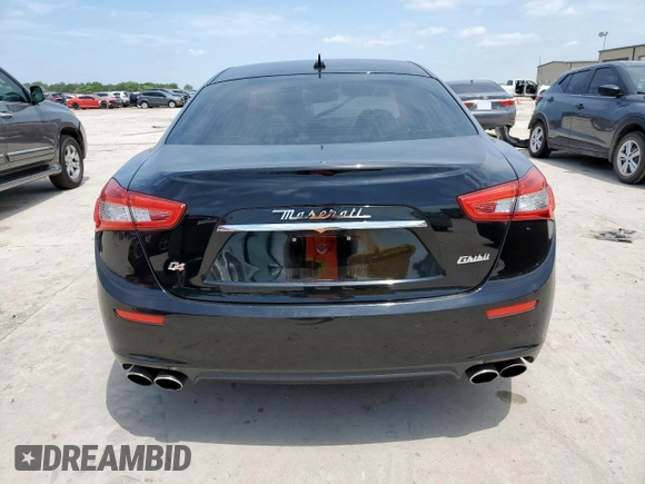 2014 Maserati Ghibli S Q4 with VIN ZAM57RTA8E1097777, listed as a Copart auction lot 59604665 with 86,135 mi miles and Salvage title. Bid and sale history available at DreamBid. Image 6.