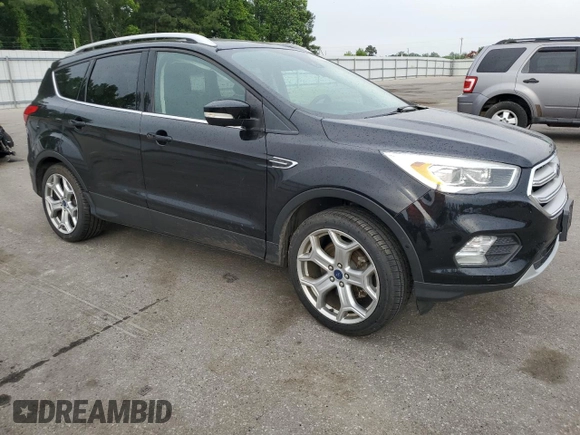 2019 Ford Escape Titanium with VIN 1FMCU0J95KUB14713, listed as a Copart auction lot 55887895 with 85,414 mi miles and Salvage title. Bid and sale history available at DreamBid. Image 4.
