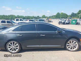 2013 Cadillac XTS Luxury z VIN 2G61P5S37D9110658, wystawiony jako IAAI lot #42196442 z przebiegiem 182 228 mil mil oraz . Historia ofert i sprzedaży dostępna na DreamBid. Obrazek 14.