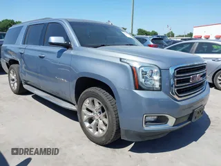 2015 GMC Yukon XL SLE z VIN 1GKS1GKC1FR721006, wystawiony jako IAAI lot #41998796 z przebiegiem 133 942 mil mil oraz . Historia ofert i sprzedaży dostępna na DreamBid. Obrazek 1.