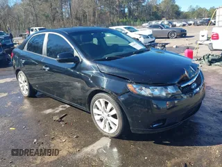 2012 Kia Forte SX with VIN KNAFW4A3XC5563571, listed as a IAAI auction lot 41590629 with 115,993 mi miles. Bid and sale history available at carsss.com. Image 1.