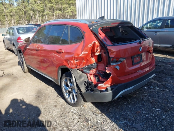 2015 BMW X1 xDrive28i with VIN WBAVL1C58FVY24900, listed as a IAAI auction lot 41772097 with 128,001 mi miles. Bid and sale history available at carsss.com. Image 3.