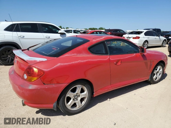 2003 Hyundai Tiburon GT z VIN KMHHN65F53U041351, wystawiony jako Copart lot #52332395 z przebiegiem 194 821 mil mil oraz Czysty tytuł • Clean title. Historia ofert i sprzedaży dostępna na DreamBid. Obrazek 3.