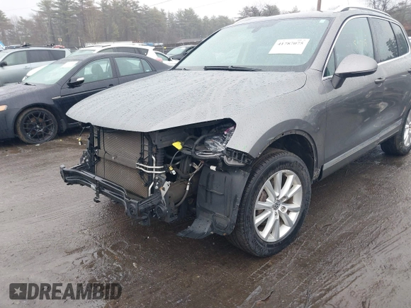 2013 Volkswagen Touareg Lux with VIN WVGEF9BP7DD007170, listed as a IAAI auction lot 41787075 with 131,089 mi miles and . Bid and sale history available at DreamBid. Image 6.