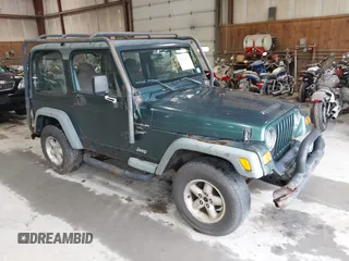 2000 Jeep Wrangler Sport z VIN 1J4FA49S5YP725979, wystawiony jako IAAI lot #42478811 z przebiegiem 203 135 mil mil oraz . Historia ofert i sprzedaży dostępna na DreamBid. Obrazek 1.