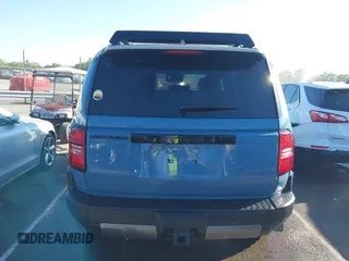 2024 Toyota Land Cruiser z VIN JTEABFAJ7RK003144, wystawiony jako IAAI lot #42040885 z przebiegiem 4 749 mil mil oraz . Historia ofert i sprzedaży dostępna na DreamBid. Obrazek 16.