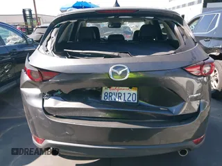 2020 Mazda CX-5 Grand Touring with VIN JM3KFADM3L1812649, listed as a IAAI auction lot 42575393 with 102,118 mi miles and . Bid and sale history available at DreamBid. Image 17.