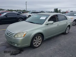2005 Toyota Avalon XL with VIN 4T1BK36B65U005616, listed as a IAAI auction lot 41404396 with 99,397 mi miles and . Bid and sale history available at DreamBid. Image 2.
