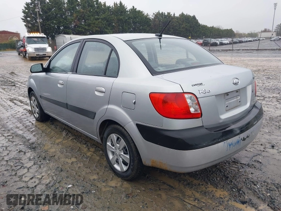 2009 Kia Rio SX with VIN KNADE223596538965, listed as a IAAI auction lot 42029409 with 143,794 mi miles. Bid and sale history available at carsss.com. Image 3.