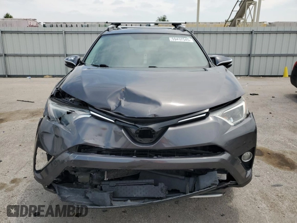 2016 Toyota RAV4 XLE with VIN 2T3RFREV0GW412875, listed as a Copart auction lot 59497545 with 226,604 mi miles and Salvage title. Bid and sale history available at DreamBid. Image 5.