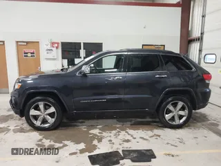 2014 Jeep Grand Cherokee Overland with VIN 1C4RJFCT9EC234270, listed as a IAAI auction lot 41938621 with 144,541 mi miles and . Bid and sale history available at DreamBid. Image 14.