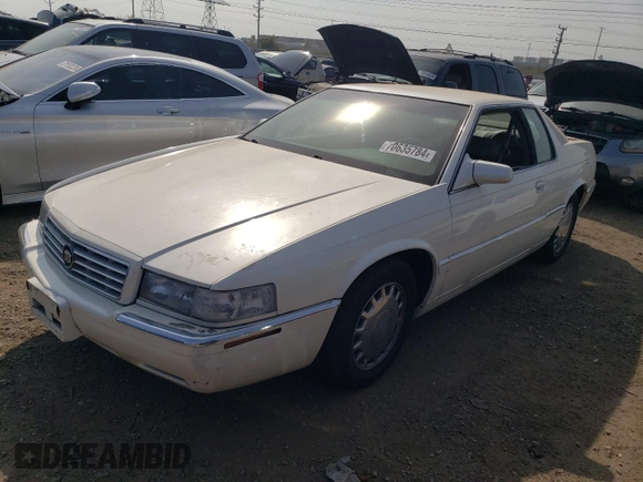 2000 Cadillac Eldorado z VIN 1G6EL12Y2YU179560, wystawiony jako Copart lot #70635784 z przebiegiem 92 959 mil mil oraz Czysty tytuł • Clean title. Historia ofert i sprzedaży dostępna na DreamBid. Obrazek 1.
