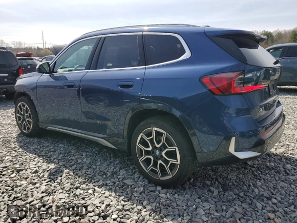 2023 BMW X1 xDrive28i with VIN WBX73EF05P5Y21721, listed as a Copart auction lot 50749295 with 10,633 mi miles and Salvage title. Bid and sale history available at DreamBid. Image 2.