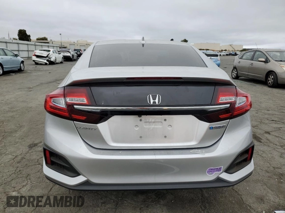 2018 Honda Clarity with VIN JHMZC5F16JC021736, listed as a Copart auction lot 71761784 with 93,541 mi miles and Salvage Title. Bid and sale history available at DreamBid. Image 6.
