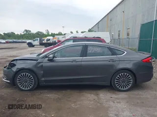 2017 Ford Fusion Titanium with VIN 3FA6P0K96HR208757, listed as a IAAI auction lot 42400172 with 90,000 mi miles and . Bid and sale history available at DreamBid. Image 14.