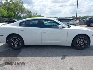 2014 Dodge Charger SXT z VIN 2C3CDXJG8EH339862, wystawiony jako IAAI lot #42373763 z przebiegiem 171 009 mil mil oraz . Historia ofert i sprzedaży dostępna na DreamBid. Obrazek 13.