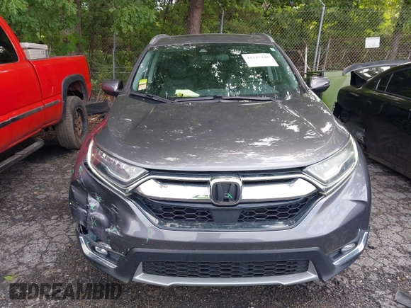 2018 Honda CR-V Touring z VIN 7FARW1H9XJE040530, wystawiony jako IAAI lot #42227446 z przebiegiem 101 299 mil mil oraz . Historia ofert i sprzedaży dostępna na DreamBid. Obrazek 12.