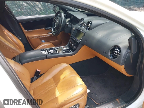 2014 Jaguar XJ with VIN SAJWA2EK8EMV67443, listed as a IAAI auction lot 42483075 with 88,357 mi miles and . Bid and sale history available at DreamBid. Image 5.