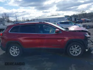 2014 Jeep Cherokee Latitude z VIN 1C4PJMCSXEW141453, wystawiony jako IAAI lot #41975311 z przebiegiem 150 085 mil mil oraz . Historia ofert i sprzedaży dostępna na DreamBid. Obrazek 13.