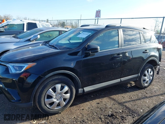 2018 Toyota RAV4 LE with VIN 2T3BFREV8JW706999, listed as a IAAI auction lot 41863485 with 115,589 mi miles. Bid and sale history available at carsss.com. Image 14.