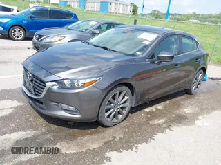 2018 Mazda 3 Touring z VIN 3MZBN1L35JM271525, wystawiony jako IAAI lot #42112552 z przebiegiem 107 299 mil mil oraz . Historia ofert i sprzedaży dostępna na DreamBid. Obrazek 2.