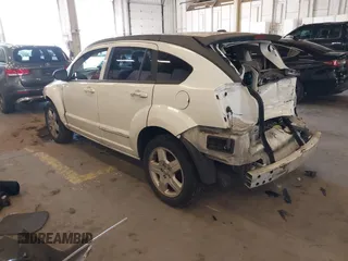 2009 Dodge Caliber SXT with VIN 1B3HB48A89D116734, listed as a IAAI auction lot 41959281 with 209,136 mi miles and . Bid and sale history available at DreamBid. Image 3.