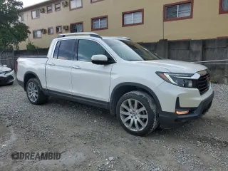 2023 Honda Ridgeline RTL-E with VIN 5FPYK3F76PB064582, listed as a Copart auction lot 63629375 with 11,940 mi miles and Salvage title. Bid and sale history available at DreamBid. Image 4.