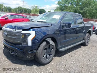 2023 Ford F-150 Lightning Pro with VIN 1FT6W1EVXPWG42428, listed as a IAAI auction lot 39711091 with 6,308 mi miles. Bid and sale history available at carsss.com. Image 23.