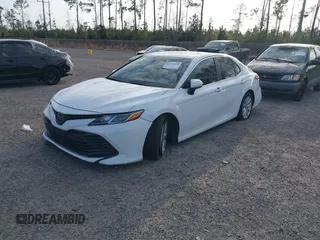 2019 Toyota Camry LE with VIN 4T1B11HK7KU806197, listed as a IAAI auction lot 41721148 with 83,373 mi miles and . Bid and sale history available at DreamBid. Image 2.