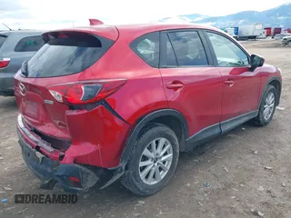 2014 Mazda CX-5 Touring with VIN JM3KE2CY3E0355296, listed as a IAAI auction lot 41688625 with 164,390 mi miles. Bid and sale history available at carsss.com. Image 4.