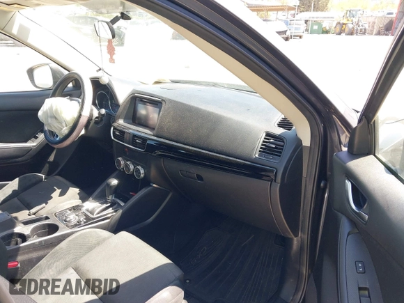 2016 Mazda CX-5 Sport with VIN JM3KE2BY2G0781565, listed as a IAAI auction lot 42042256 with 182,186 mi miles. Bid and sale history available at carsss.com. Image 5.