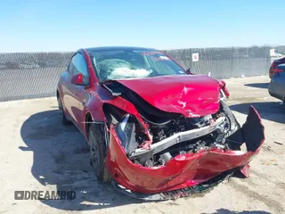 2024 Tesla Model Y with VIN 7SAYGDED6RA300819, listed as a IAAI auction lot 41769635 with 11,812 mi miles and . Bid and sale history available at DreamBid. Image 1.