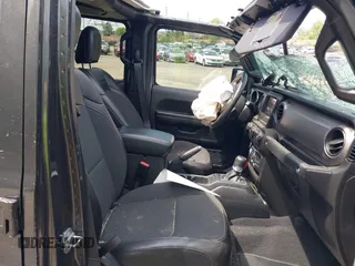 2021 Jeep Gladiator Freedom with VIN 1C6HJTAG3ML557932, listed as a IAAI auction lot 42150245 with 26,656 mi miles and . Bid and sale history available at DreamBid. Image 5.