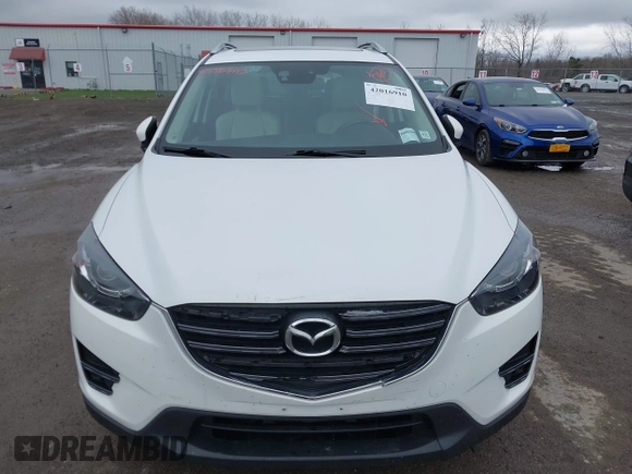 2016 Mazda CX-5 Grand Touring z VIN JM3KE4DY0G0705884, wystawiony jako IAAI lot #42016910 z przebiegiem 73 324 mil mil oraz . Historia ofert i sprzedaży dostępna na DreamBid. Obrazek 12.