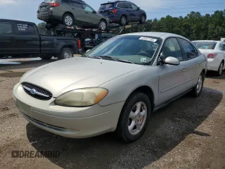 2003 Ford Taurus SE Standard with VIN 1FAFP53233G210299, listed as a Copart auction lot 63337135 with 192,334 mi miles and Salvage title. Bid and sale history available at DreamBid. Image 1.