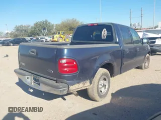 2003 Ford F-150 XLT with VIN 1FTRW07673KC94022, listed as a IAAI auction lot 41789268 with 271,047 mi miles. Bid and sale history available at carsss.com. Image 4.