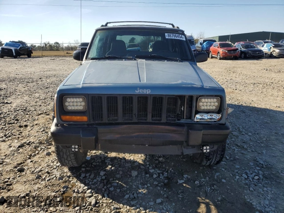 1998 Jeep Cherokee Sport with VIN 1J4FT68S0WL138603, listed as a Copart auction lot 86766454 with 0 mi miles and Salvage Title. Bid and sale history available at carsss.com. Image 5.