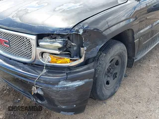 2005 GMC Yukon Denali z VIN 1GKEK63U55J105401, wystawiony jako IAAI lot #41857659 z przebiegiem 265 877 mil mil oraz . Historia ofert i sprzedaży dostępna na DreamBid. Obrazek 6.