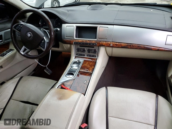 2015 Jaguar XF V6 Portfolio with VIN SAJWA0F78F8U87018, listed as a Copart auction lot 79106944 with 108,752 mi miles and Salvage Title. Bid and sale history available at carsss.com. Image 8.