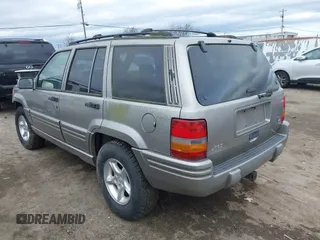 1998 Jeep Grand Cherokee Limited with VIN 1J4GZ88Z7WC223496, listed as a IAAI auction lot 41484317 with 244,567 mi miles. Bid and sale history available at carsss.com. Image 3.