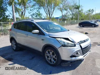 2016 Ford Escape Titanium with VIN 1FMCU0JX2GUC39416, listed as a IAAI auction lot 41793375 with 146,877 mi miles. Bid and sale history available at carsss.com. Image 1.