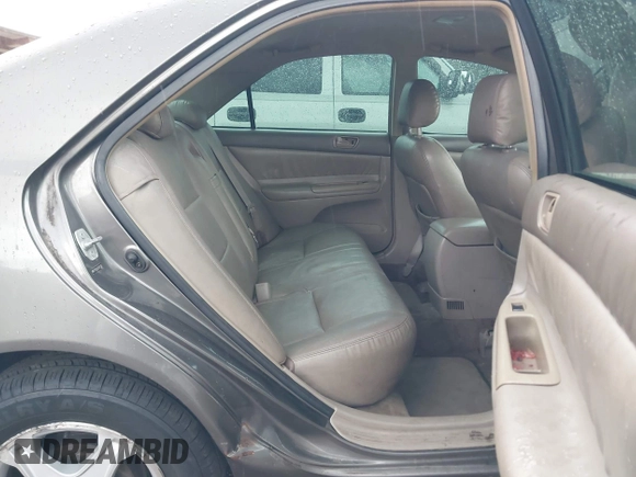 2004 Toyota Camry LE with VIN 4T1BE30K24U921028, listed as a IAAI auction lot 42187174 with 295,174 mi miles and . Bid and sale history available at DreamBid. Image 8.
