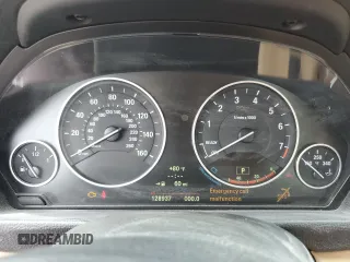 2014 BMW 3 Series 328i xDrive with VIN WBA3B3C59EJ977670, listed as a Copart auction lot 61997165 with 128,937 mi miles and Salvage title. Bid and sale history available at DreamBid. Image 9.